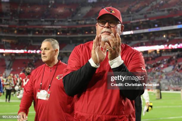 Head coach Bruce Arians of the Arizona Cardinals walks off the field following the NFL game against the New York Giants at the University of Phoenix...