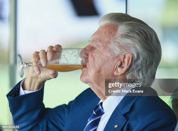 Former Australian Prime Minister Bob Hawke skulls a cold beer during day two of the Fifth Test match in the 2017/18 Ashes Series between Australia...