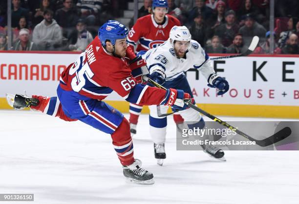 Andrew Shaw of the Montreal Canadiens takes a shot against the Tampa Bay Lightning in the NHL game at the Bell Centre on January 4, 2018 in Montreal,...