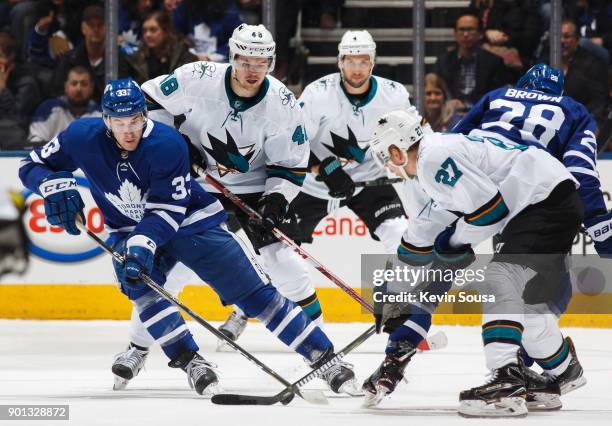 Frederik Gauthier of the Toronto Maple Leafs skates against Tomas Hertl and Joonas Donskoi of the San Jose Sharksduring the first period at the Air...