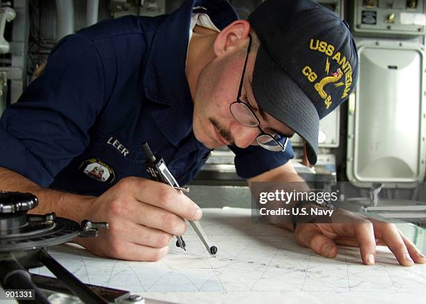 One of the daily duties of a Quartermaster aboard USS Antietam is to plot a fix of the ship's position on the chart at certain times to maintain an...