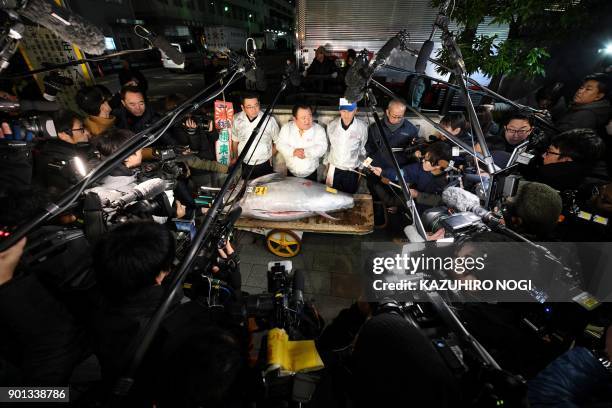 President of sushi restaurant chain Sushi-Zanmai, Kiyoshi Kimura , displays a 190-kilogram bluefin tuna near Tokyo's Tsukiji fish market on January...