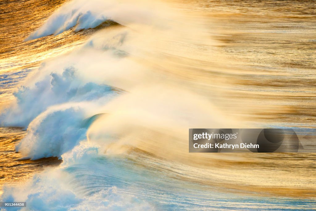 Ocean shot with breaking waves and early morning light
