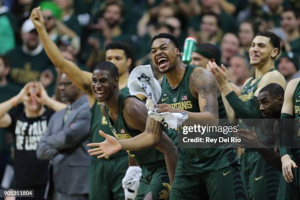 Nick Ward and Jaren Jackson Jr. #2 of the Michigan State Spartans celebrate from the bench during the game against the Maryland Terrapins at Breslin...