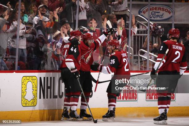 Anthony Duclair of the Arizona Coyotes is congratulated by Kevin Connauton, Freddie Hamilton and Luke Schenn after Duclair scored a goal against the...