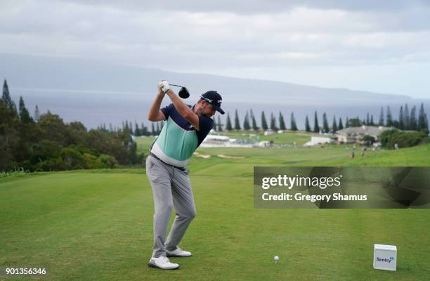 Marc Leishman of Australia plays his shot from the 18th tee during the first round of the Sentry Tournament of Champions at Plantation Course at...