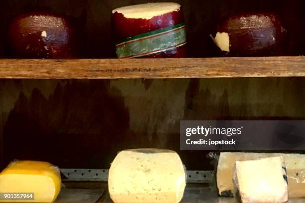 stack of provolone cheese - provolone stock-fotos und bilder