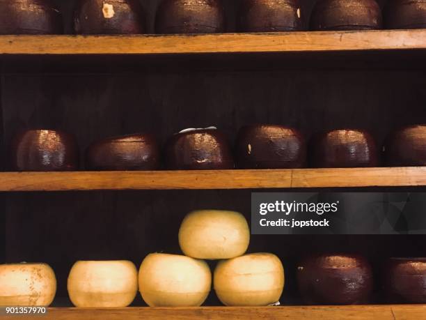 stack of provolone cheese - provolone stock-fotos und bilder