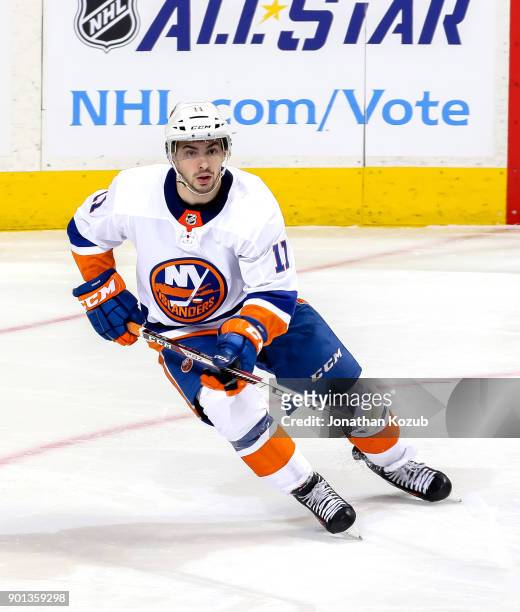 Shane Prince of the New York Islanders keeps an eye on the play during second period action against the Winnipeg Jets at the Bell MTS Place on...