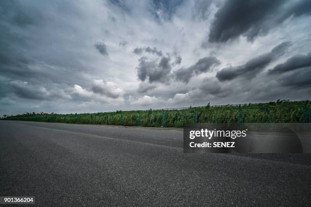 empty road - overcast stock pictures, royalty-free photos & images