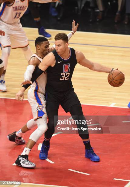 Oklahoma City Thunder Guard Russell Westbrook guards Los Angeles Clippers Forward Blake Griffin during an NBA game between the Oklahoma City Thunder...