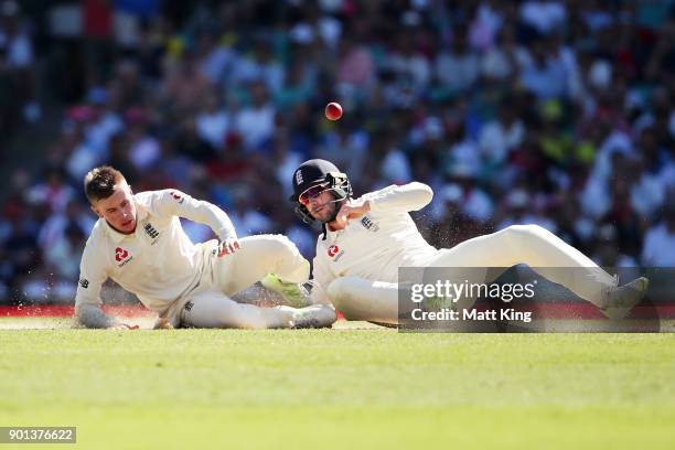 Mason Crane of England nearly collides with fielder Mark Stoneman of England as he attempts to catch his own delivery during day two of the Fifth...