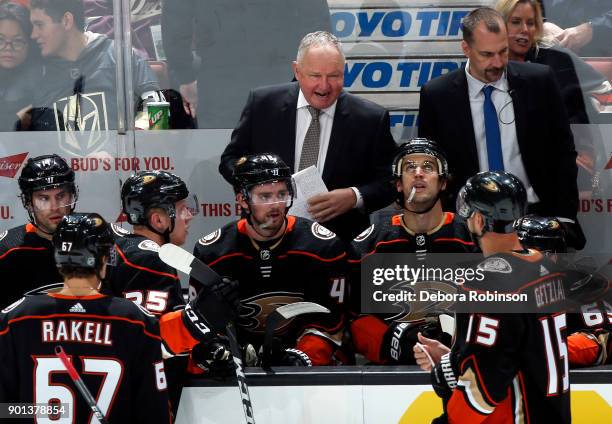 Anaheim Ducks head coach Randy Carlyle talks with his players behind the bench against the Vegas Golden Knights on December 27, 2017 at Honda Center...