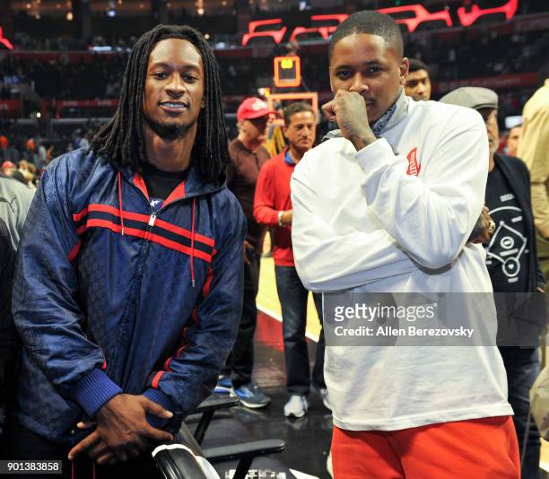 Player Todd Gurley and Rapper YG attend a basketball game between the Los Angeles Clippers and the Oklahoma City Thunder at Staples Center on January...