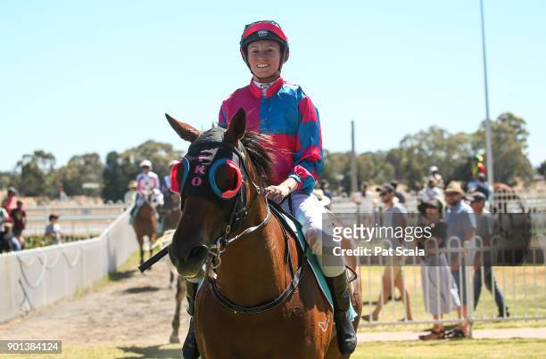 Katelyn Mallyon returns to the mounting yard on Magromeus after winning Lake Fyans Holiday Park BM58 Handicap,at Stawell Racecourse on January 05,...