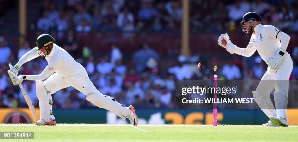 England's wicketkeeper Jonny Bairstow attempts to stump Australia's Usman Khawaja on the second day of the fifth Ashes cricket Test match at the SCG...