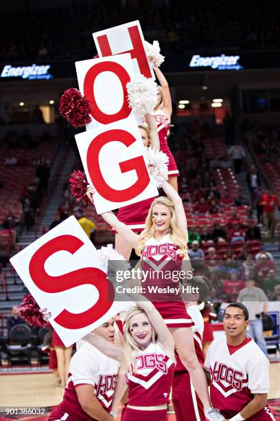 Cheerleaders of the Arkansas Razorbacks perform before a game against the CSU-Bakersfield Roadrunners at Bud Walton Arena on December 27, 2017 in...