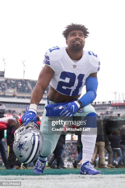 Running back Ezekiel Elliott of the Dallas Cowboys takes a knee before playing against the Philadelphia Eagles during the first quarter of the game...