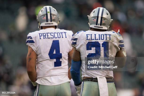 Dak Prescott and Ezekiel Elliott of the Dallas Cowboys look on against the Philadelphia Eagles at Lincoln Financial Field on December 31, 2017 in...