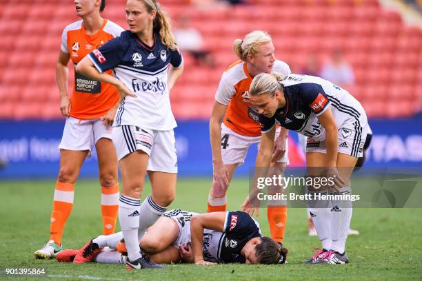 Laura Alleway of Melbourne lays on the field injured during the round ten W-League match between the Brisbane Roar and Melbourne Victory at Suncorp...