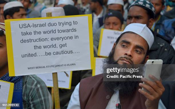 An Indian Muslim take part a protest meeting against Trump's aggression on Palestine in Kolkata. West Bengal State Jamait Ulama -E-Hind activists and...