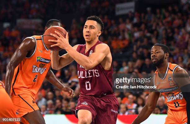 Travis Trice of the Bullets drives to the basket during the round 13 NBL match between the Cairns Taipans and the Brisbane Bullets at the Cairns...
