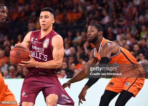 Travis Trice of the Bullets has his pants pulled by Scoochie Smith of the Taipans during the round 13 NBL match between the Cairns Taipans and the...