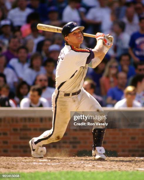 Craig Biggio of the Houston Astros bats during an MLB game versus the Chicago Cubs at Wrigley Field in Chicago, Illinois during the 1989 season.