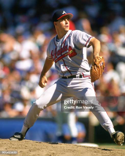 Greg Maddux of the Atlanta Braves pitches during an MLB game against the Chicago Cubs at Wrigley Field in Chicago, Illinois during the 1993 season.