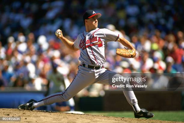 Greg Maddux of the Atlanta Braves pitches during an MLB game against the Chicago Cubs at Wrigley Field in Chicago, Illinois during the 1993 season.