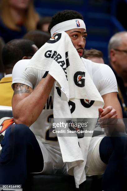 Anthony Davis of the New Orleans Pelicans wipes his brow with a Gatorade towel during the first half of a NBA game against the New York Knicks at the...