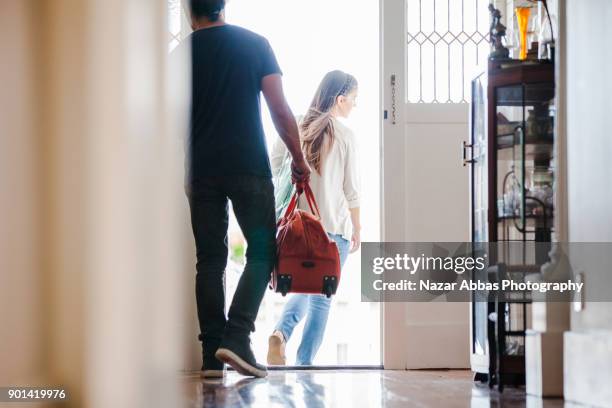 off we go for a trip. - suitcase couple stockfoto's en -beelden