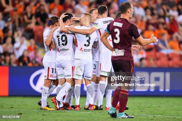 Mark Bridge of the Wanderers celebrates scoring a goal with team mates during the round 14 A-League match between the Brisbane Roar and the Western...