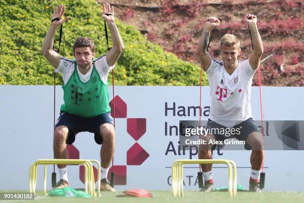 Thomas Mueller and Niklas Dorsch exercise during a training session on day 4 of the FC Bayern Muenchen training camp at ASPIRE Academy for Sports...