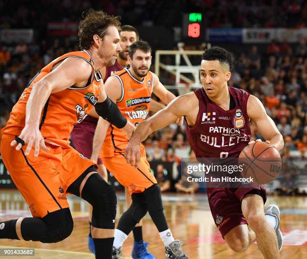 Travis Trice of the Bullets drives to the basket past Alex Loughton of the Taipans during the round 13 NBL match between the Cairns Taipans and the...