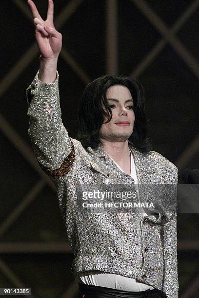 This January 2, 2002 file photo shows US pop singer Michael Jackson saluting the audience after receiving the Artist of the Century Award during the...
