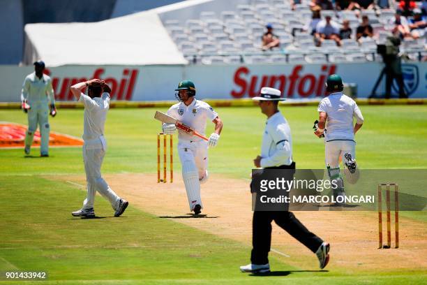 India bowler Mohammed Shami reacts as South Africa's batsman AB de Villiers scores a four during day one of the First Test between South Africa and...