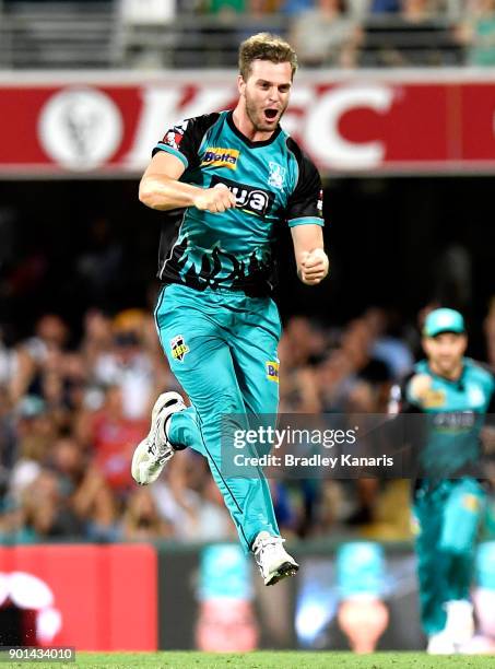 Mark Steketee of the Heat celebrates taking the wicket of Hilton Cartwright of the Scorchers during the Big Bash League match between the Brisbane...