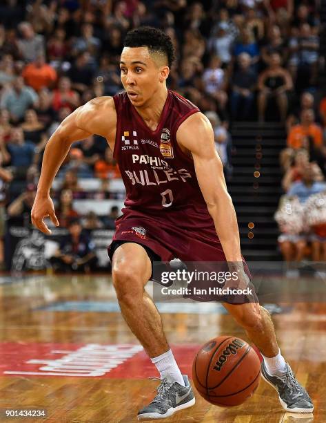 Travis Trice of the Bullets dribbles the ball during the round 13 NBL match between the Cairns Taipans and the Brisbane Bullets at the Cairns...