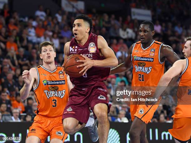 Travis Trice of the Bullets drives to the basket during the round 13 NBL match between the Cairns Taipans and the Brisbane Bullets at the Cairns...