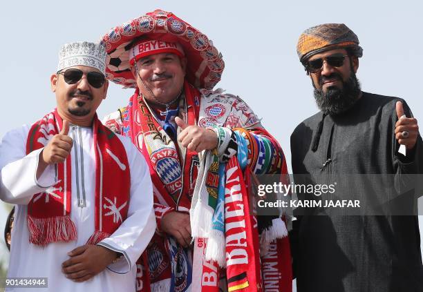 Omani Bayern Munich fans watch the team train during their winter training camp at the Aspire Academy for Sports Excellence in the Qatari capital...