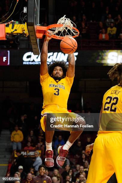 Jordan Murphy of the Minnesota Golden Gophers dunks the ball against the Illinois Fighting Illini during the game on January 3, 2018 at Williams...