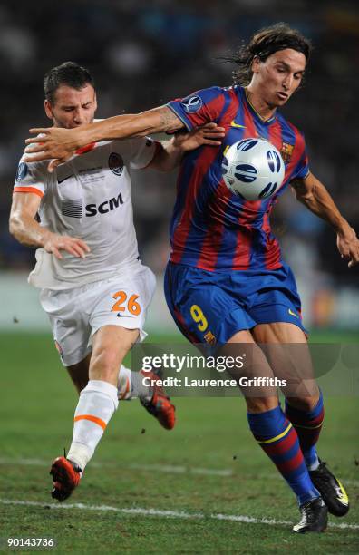 Zlatan Ibrahimovic of Barcelona battles with Razvan Rat of Shakhtar Donetsk during the UEFA Super Cup Final between FC Barcelona and Shakhtar Donetsk...