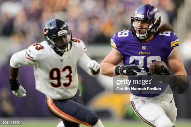 David Morgan of the Minnesota Vikings carries the ball against Sam Acho of the Chicago Bears during the game on December 31, 2017 at U.S. Bank...