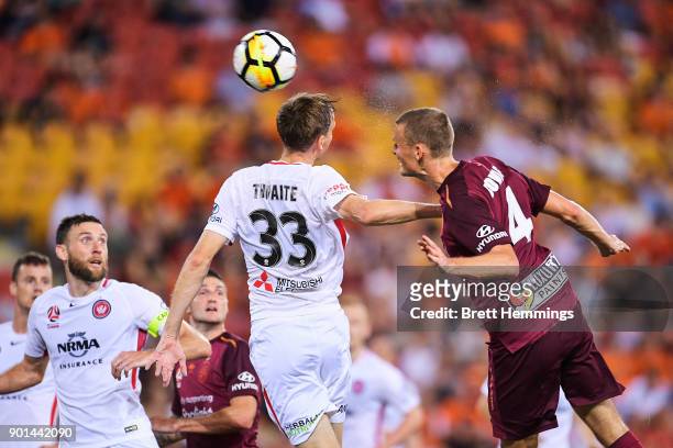 Daniel Bowles of Brisbane and Michael Thwaite of the Wanderers contest a corner kick during the round 14 A-League match between the Brisbane Roar and...