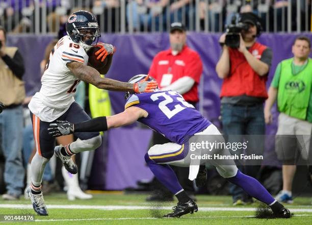 Josh Bellamy of the Chicago Bears carries the ball against Harrison Smith of the Minnesota Vikings during the game on December 31, 2017 at U.S. Bank...
