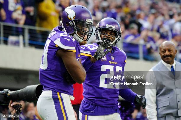 Xavier Rhodes and Terence Newman of the Minnesota Vikings celebrate a play against the Chicago Bears during the game on December 31, 2017 at U.S....
