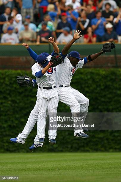Chicago Cubs outfielders Milton Bradley, Sam Fuld and Kosuke Fukudome celebrate their 5-2 win over the New York Mets at Wrigley Field on August 28,...