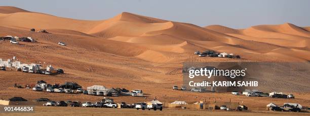 Emiratis camp in the Liwa desert, some 250 kilometres west of the Gulf Emirate of Abu Dhabi, during the Liwa 2018 Moreeb Dune Festival on January 5,...