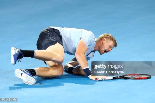 Kyle Edmund of Great Britain falls in his match against Grigor Dimitrovof of Bulgaria during day six of the 2018 Brisbane International at Pat Rafter...